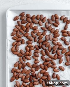 completed cinnamon almonds against a white surface