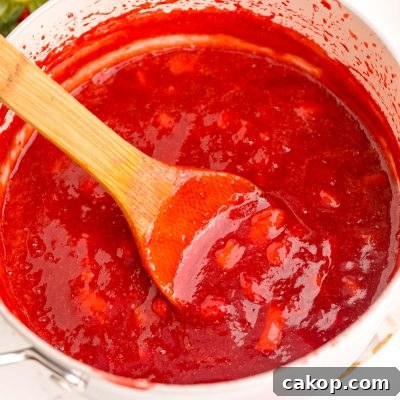 Strawberry Puree Recipe: Quick Homemade Strawberry Sauce 6 Close up photo of strawberry puree in a pot.