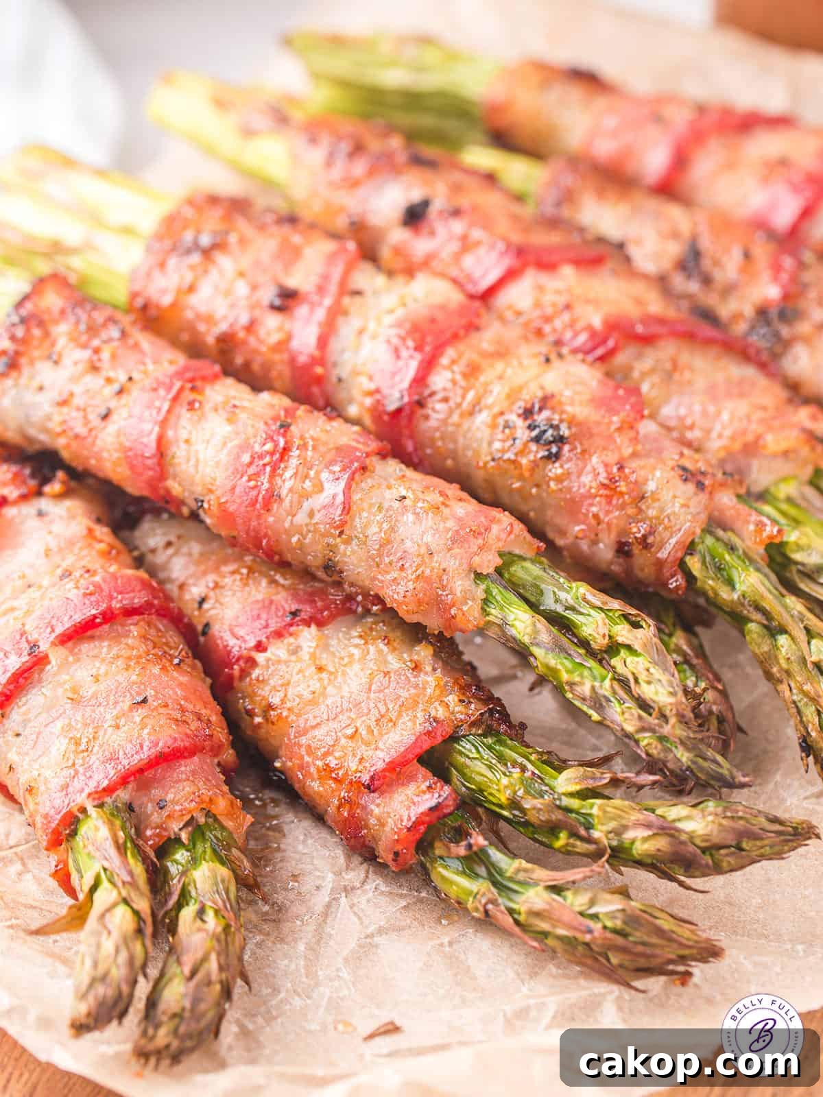 Close up of bundles of bacon wrapped asparagus.