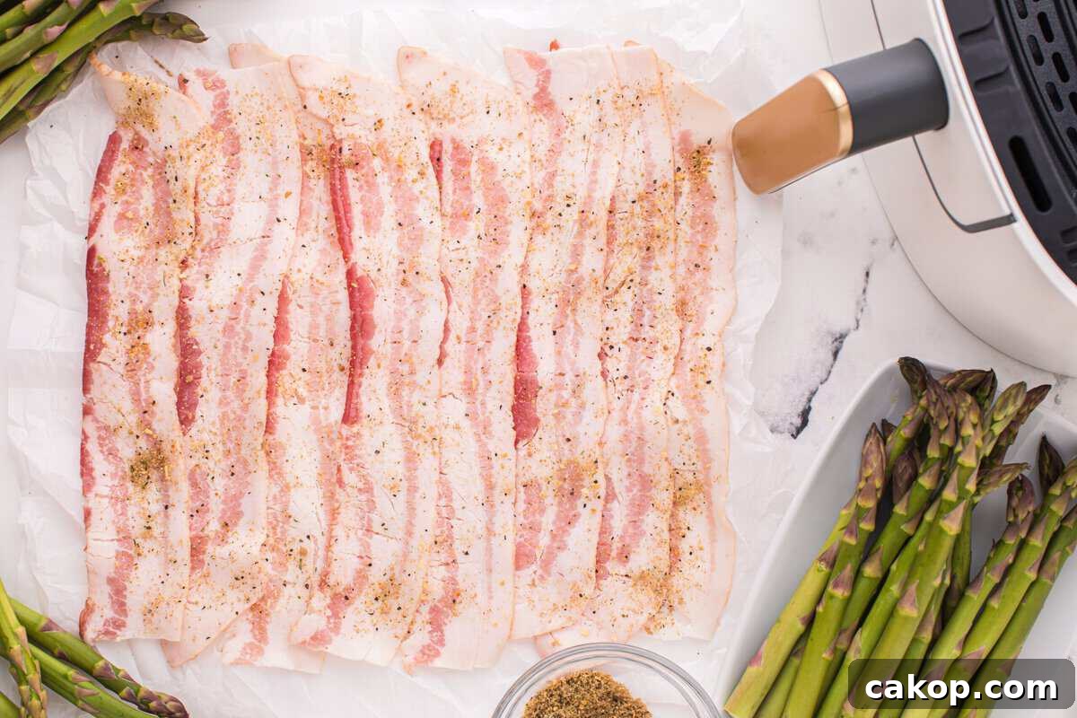 Sprinkling the seasoning over the bacon. 