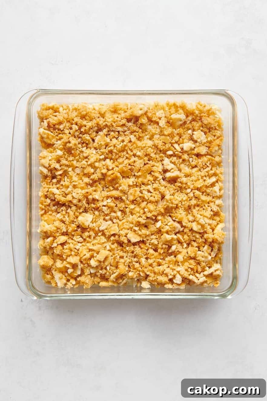 unbaked pineapple casserole in a glass 8x8 dish.