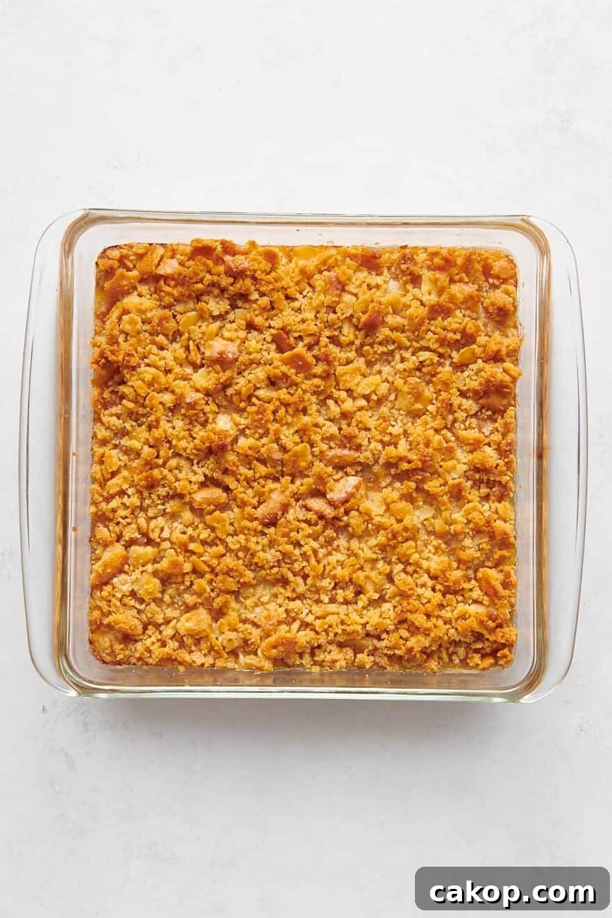 baked pineapple casserole in a glass 8x8 dish.