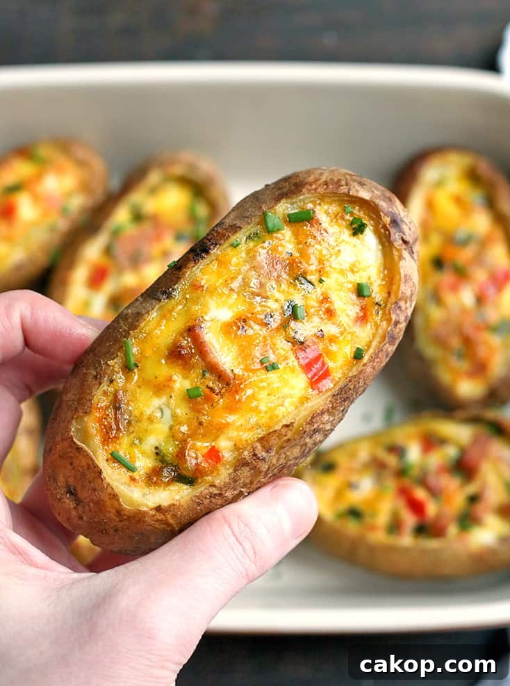 These Paleo Whole30 Egg Potato Boats are a fun and filling breakfast. Packed with sausage, peppers, green onions and of course eggs. They are gluten free, dairy free, and low FODMAP.