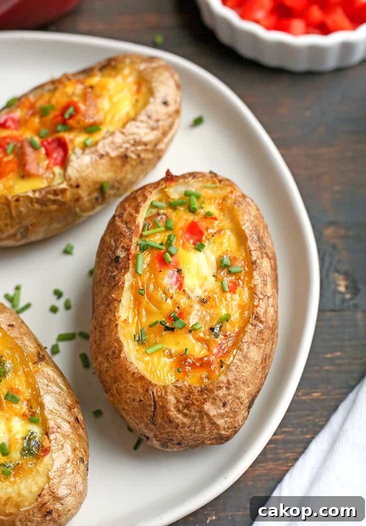 These Paleo Whole30 Egg Potato Boats are a fun and filling breakfast. Packed with sausage, peppers, green onions and of course eggs. They are gluten free, dairy free, and low FODMAP.