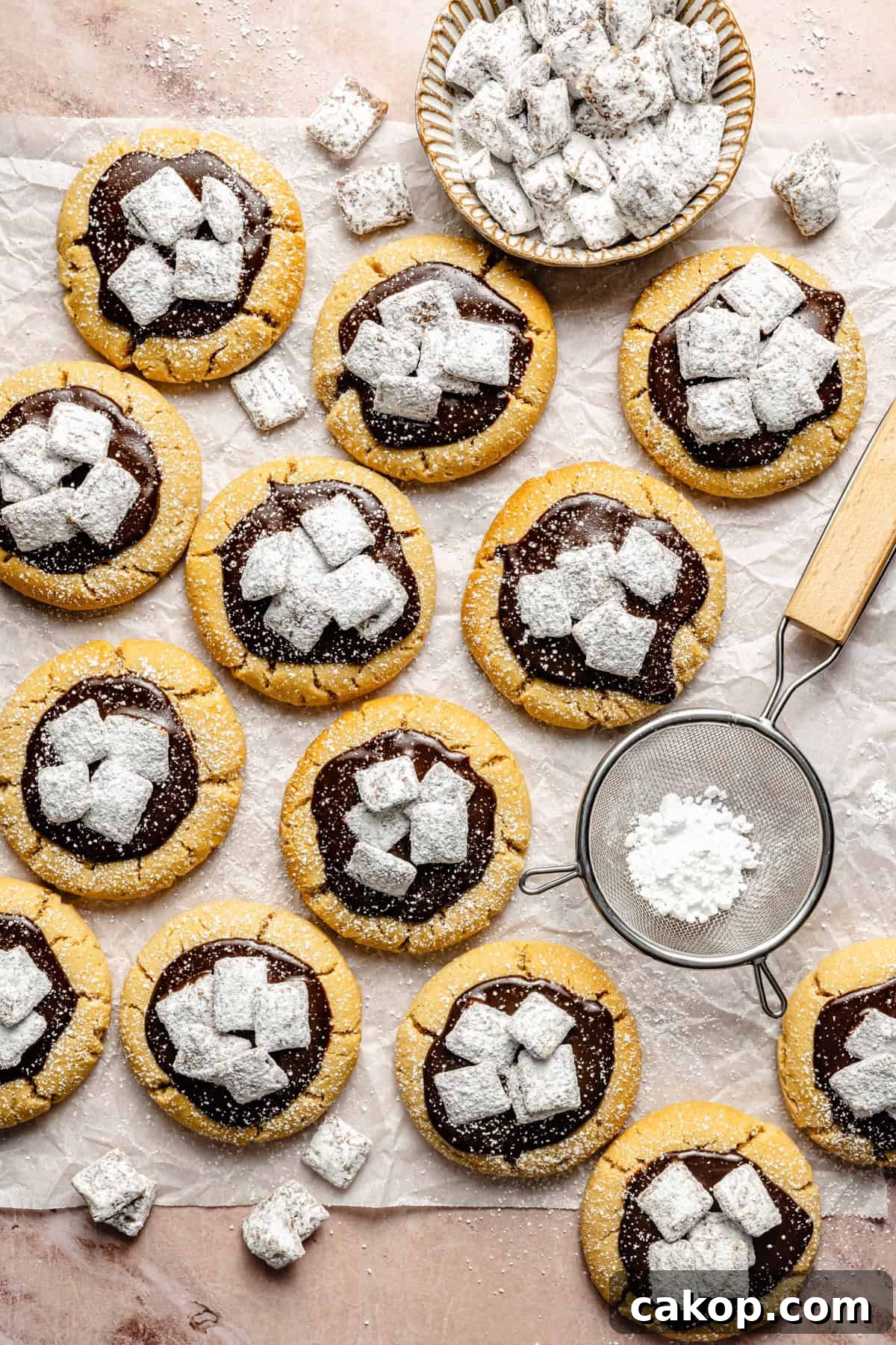 Chocolate Puppy Chow Cookies Recipe for Parties and Gifts 3 a batch of muddy buddy cookies on a piece of parchment paper.