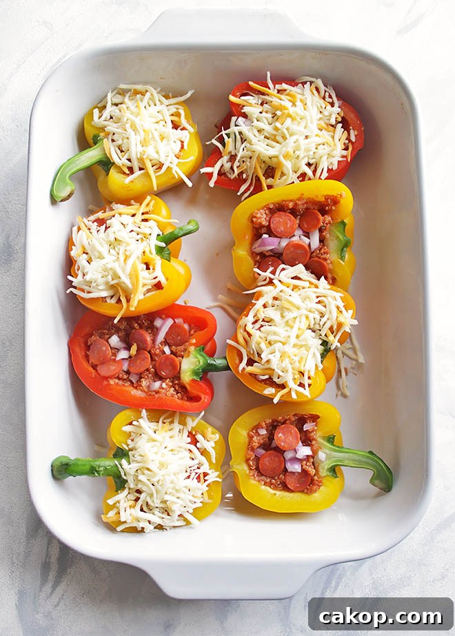 35 Minute Pizza Stuffed Peppers - Healthy stuffed pizza peppers that come together in 35 minutes. You can use any of your favorite pizza toppings you prefer. This recipe is a fun way to get your "pizza" fix! Husband approved! Gluten free | robustrecipes.com