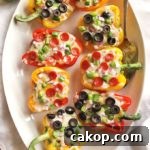 35 Minute Pizza Stuffed Peppers - Healthy stuffed pizza peppers that come together in 35 minutes. You can use any of your favorite pizza toppings you prefer. This recipe is a fun way to get your "pizza" fix! Husband approved! Gluten free | robustrecipes.com