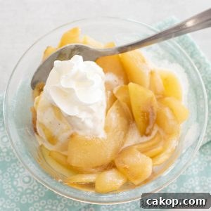stewed pears recipe in bowl with whipped cream