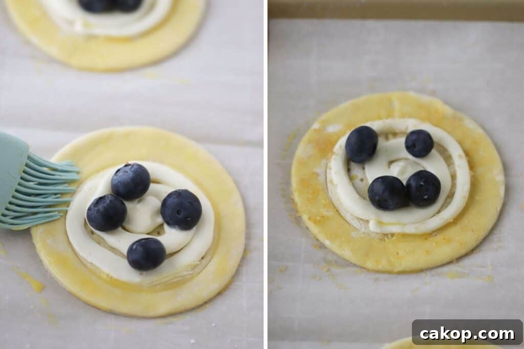 Brushing Danish dough with egg wash just before baking.