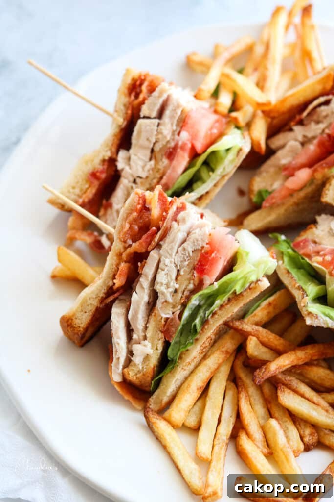 Classic Turkey Club Sandwich Recipe with Crispy Bacon & Avocado 3 close up classic turkey club sandwich with fries