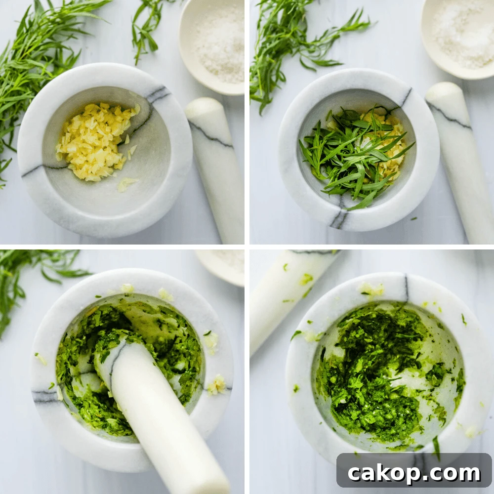 making tarragon paste for the aioli in a mortar and pestle.