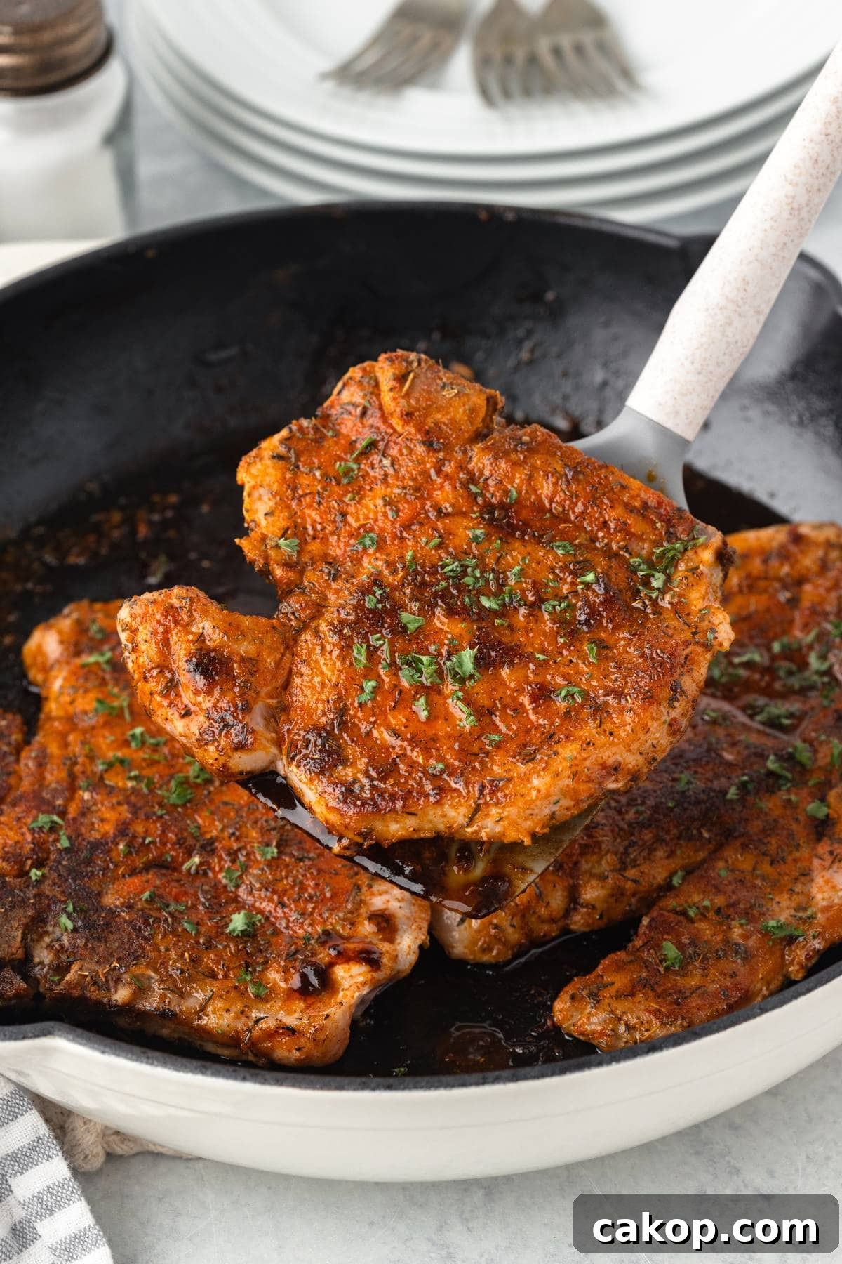 Juicy Bone-In Pork Chops: Simple Step-by-Step Cooking Guide 8 Juicy baked chicken breast with mashed potatoes and green beans on a white plate.