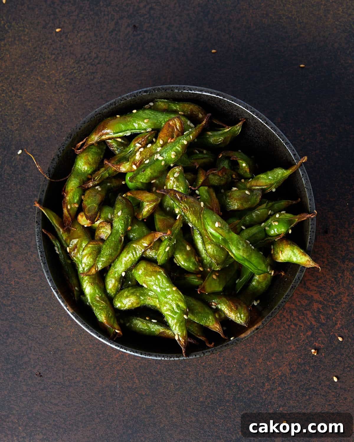 Crispy Air Fryer Frozen Edamame: Quick Snack or Side 2 Square overhead photo of a bowl full of air fryer roasted edamame beans in the pods.