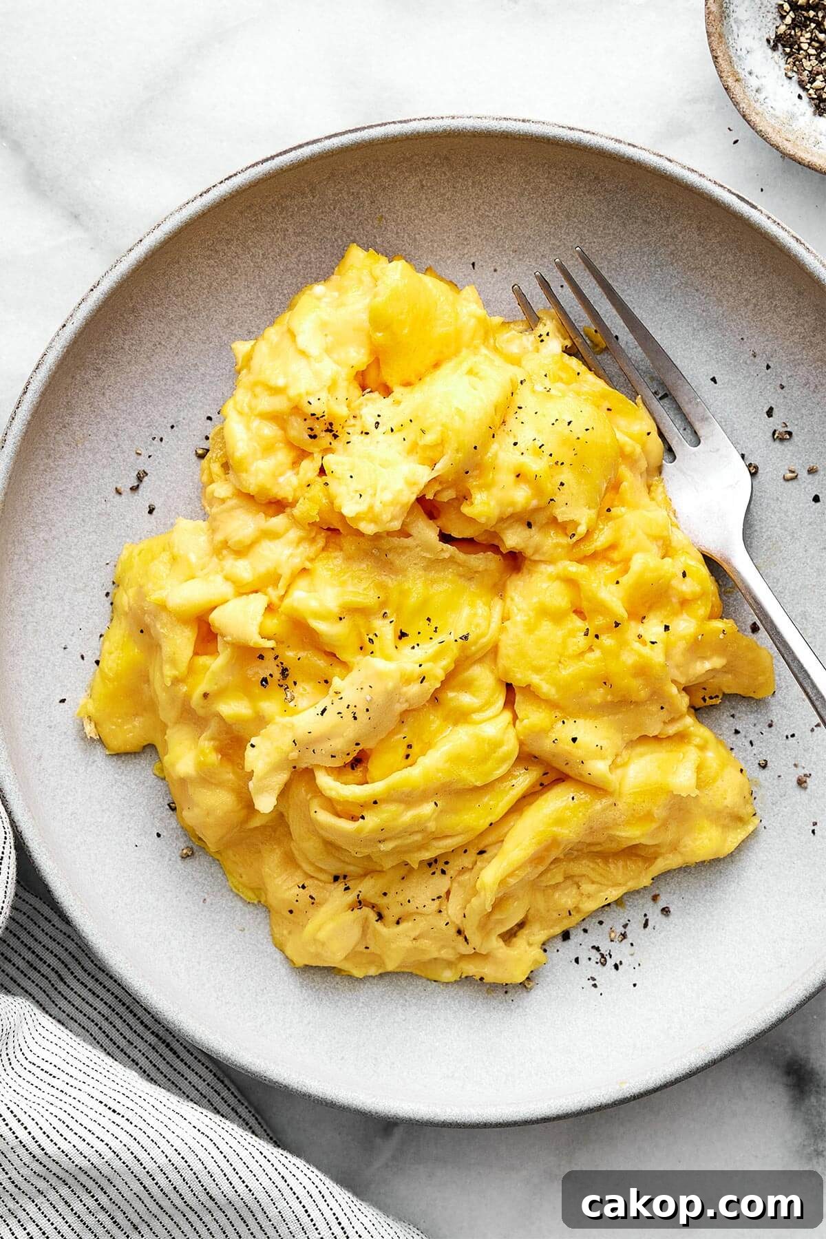 6 Quick Ways to Cook Eggs for Every Meal 4 A plate of scrambled eggs.