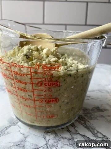 Blue cheese crumbles on top of blended ingredients.