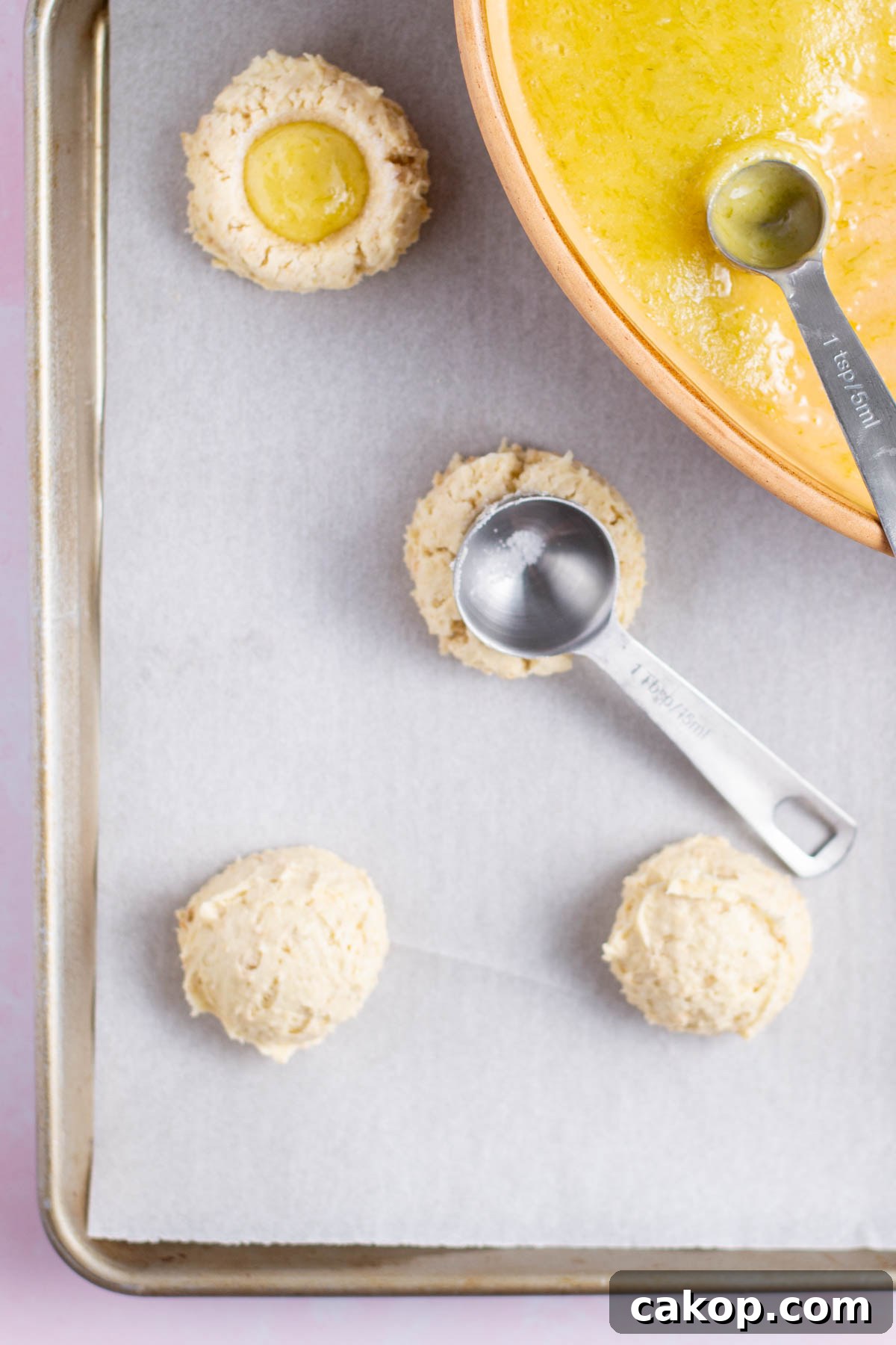 thumbprints being made with the back of a tablespoon