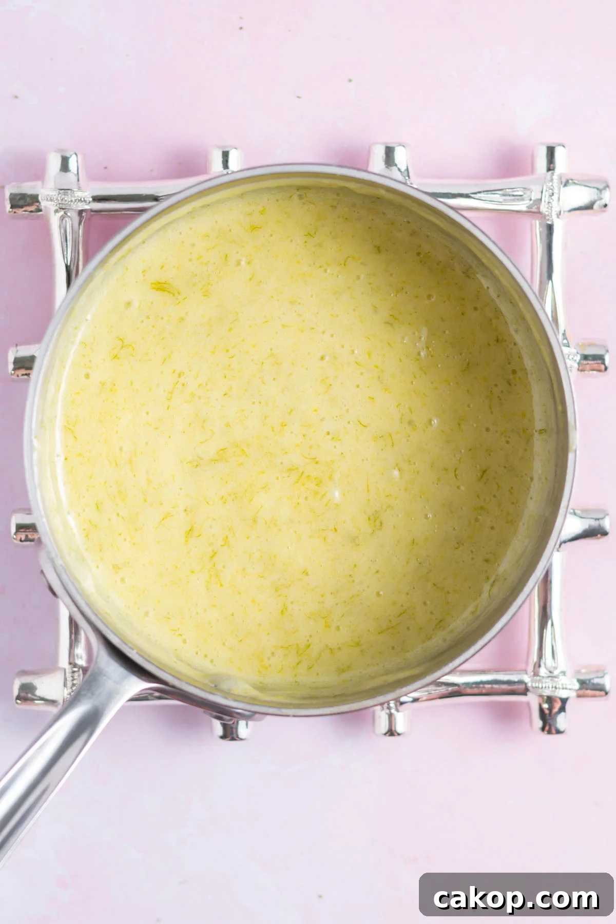 key lime curd after it's been cooked in a saucepan